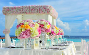 beach, bunch of flowers, celebration, chairs, colorful, colourful, decorations, flowers, island, sea, summer, table, tropical, water, wedding
