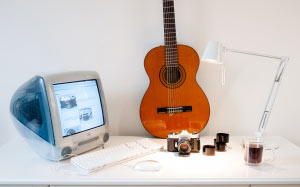 old computer, mac, guitar, desk, lamp, camera, imac g3