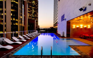 architecture, water, buildings, business, city, dusk, evening, hotel, illuminated, lounge chairs, luxury, metropolis, skyscrapers, sunset, swimming pool, urban, water, los angeles, california, usa, america