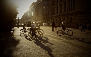 bicycles, summer, bikes, people, persons, urban, city, pedestrians, streets, road, pavement, sunset, shadows, buildings