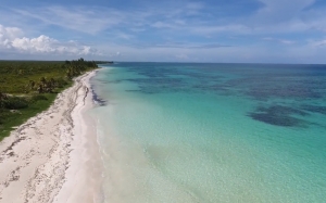 sea, beach, ocean, water, sand, travel, summer, vacation, tropical, blue, sky, shore, waves, sun, nature, white, sunny, seashore, coastline, relax, paradise, turquoise, leisure, aerial view, lagoon, exotic, island