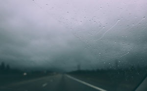 car, highway, road, raining, rain drops, wet, sky, clouds, storm, blurry
