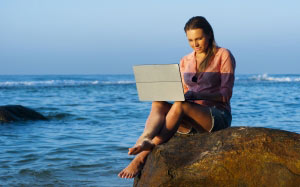 beach, lady, laptop, leisure, ocean, people, person, relaxation, rocks, sea, seashore, summer, sun, sunset, travel, vacation, wave, woman, working