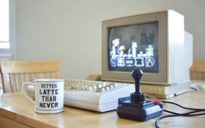 old computer, retro computer, desk, room, cup, commodore 64g, commodore 1802 display, competition pro joystick, stormlord, video game, screen