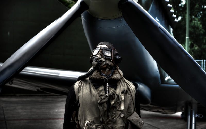 pilot, standing plane, airplane, jacket, aircraft, aviation, vintage, man, person, men, transport, wing, engine, helmet, goggles, propeller