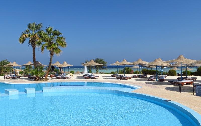 azure, beach, pool, palm trees, hotel, tables, umbrellas, deck chairs, resort, blue, sea