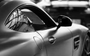 grey, car, cars, transportation, motor vehicle, vehicle, reflection, sports car, silver, shiny, luxury, metal, wealth, chrome, close-up, focus on foreground, wheel, alloy