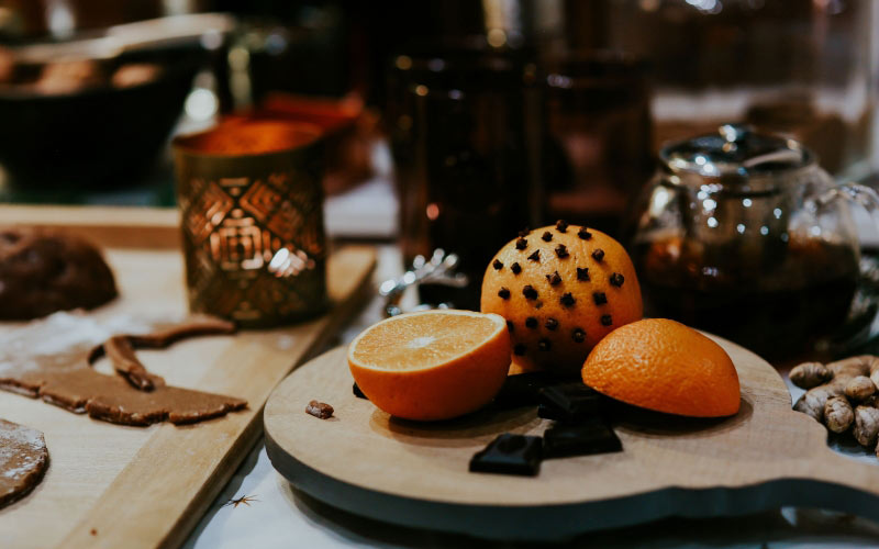 orange, christmas cake, cake, food, tableware, sweets, christmas, xmas, sweetnes, fruit, dessert, table, focus on foreground, still life, close-up, selective focus, cutting board, new year