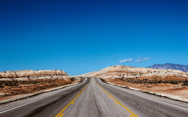 highway, road, pavement, desert, nature, outdoors, blue, sky, sunshine, summer, way, forward, transportation, mountains, landscape, cliffs