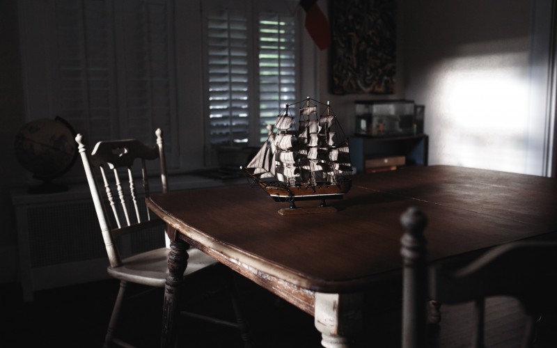 room, galleon, ship, scale model, wooden, table, dark, chair, wood, window, indoors, seat, absence, home, interior, still life, furniture